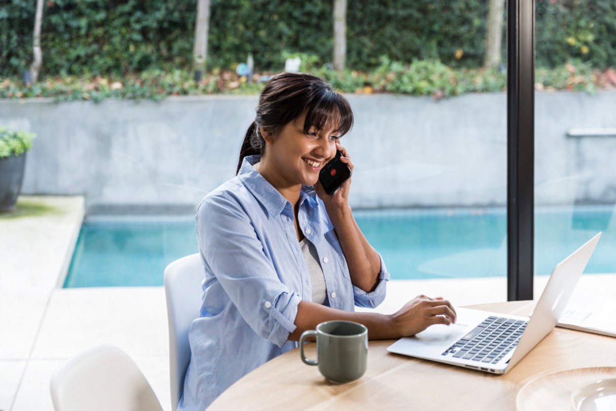 Customer on phone and laptop